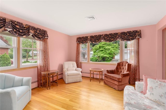 20 Loxley Rd, Providence, RI 02908 - sitting room featuring healthy amount of natural light, a baseboard radiator, and light wood-style flooring