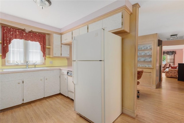 20 Loxley Rd, Providence, RI 02908 - kitchen with freestanding refrigerator, plenty of natural light, and light wood-style floors