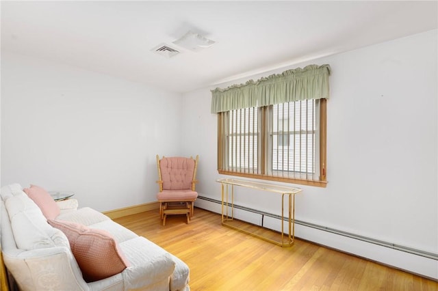20 Loxley Rd, Providence, RI 02908 - sitting room with baseboard heating, wood finished floors, and baseboards