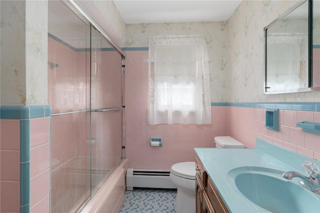 20 Loxley Rd, Providence, RI 02908 - bathroom featuring baseboard heating, tile walls, toilet, vanity, and combined bath / shower with glass door