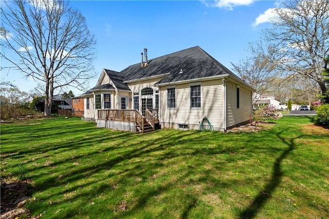 32 Trolley Ln, Westerly, RI 02891 - rear view of property featuring a wooden deck and a lawn