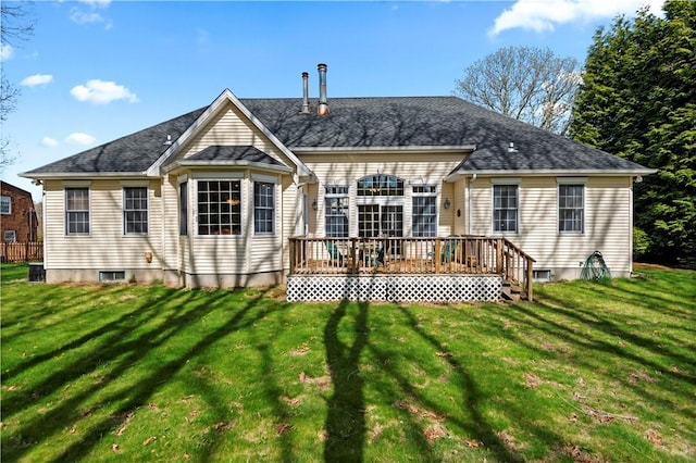 32 Trolley Ln, Westerly, RI 02891 - rear view of house featuring a wooden deck and a lawn
