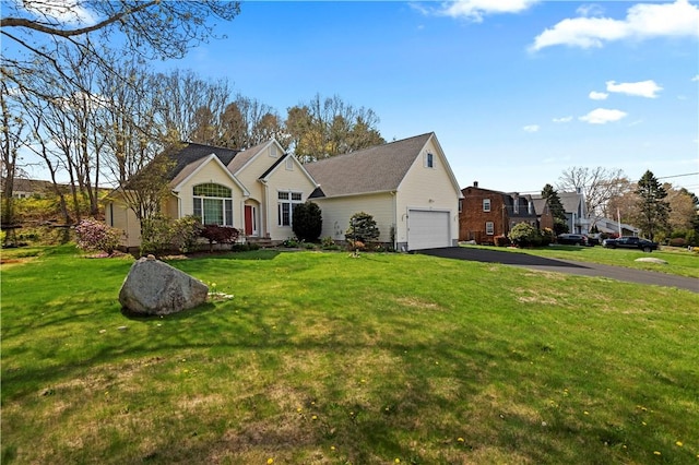 32 Trolley Ln, Westerly, RI 02891 - view of front of home featuring a garage, a front yard, and driveway