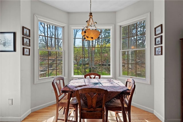 32 Trolley Ln, Westerly, RI 02891 - dining area with healthy amount of natural light, light wood finished floors, and baseboards