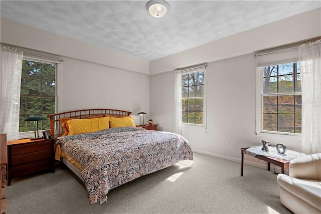 32 Trolley Ln, Westerly, RI 02891 - carpeted bedroom with multiple windows, baseboards, and a textured ceiling