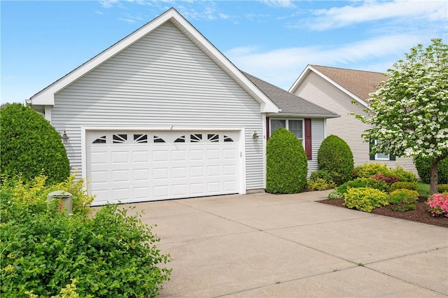 5 Enzo Dr, Coventry, RI 02816 - view of front of house with concrete driveway and a garage