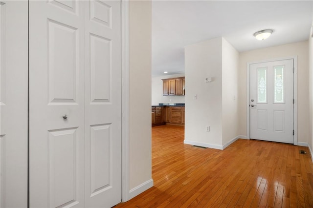 5 Enzo Dr, Coventry, RI 02816 - foyer entrance featuring light wood-style floors and baseboards