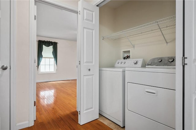 5 Enzo Dr, Coventry, RI 02816 - laundry area featuring independent washer and dryer, light wood-style floors, and baseboards