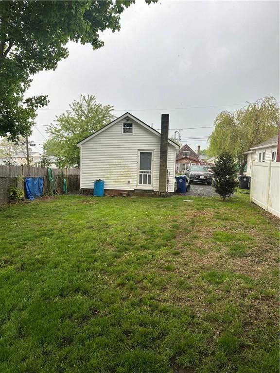 111 Samuel Gorton Ave, Warwick, RI 02889 - rear view of property featuring a chimney