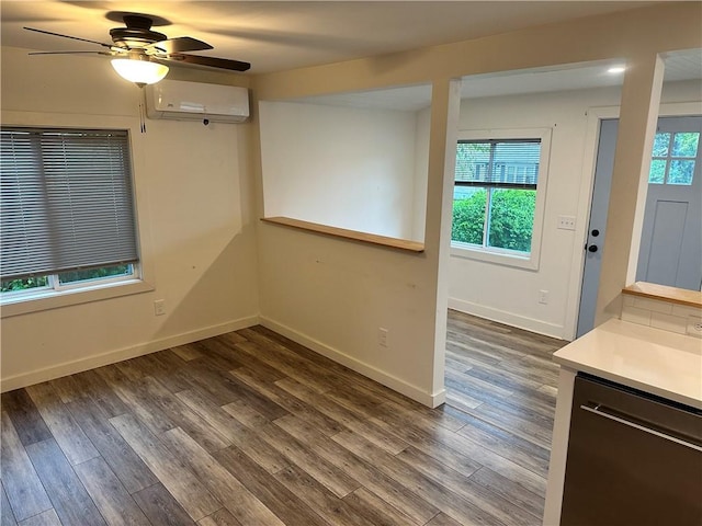 111 Samuel Gorton Ave, Warwick, RI 02889 - empty room featuring an AC wall unit, dark wood-type flooring, ceiling fan, and baseboards