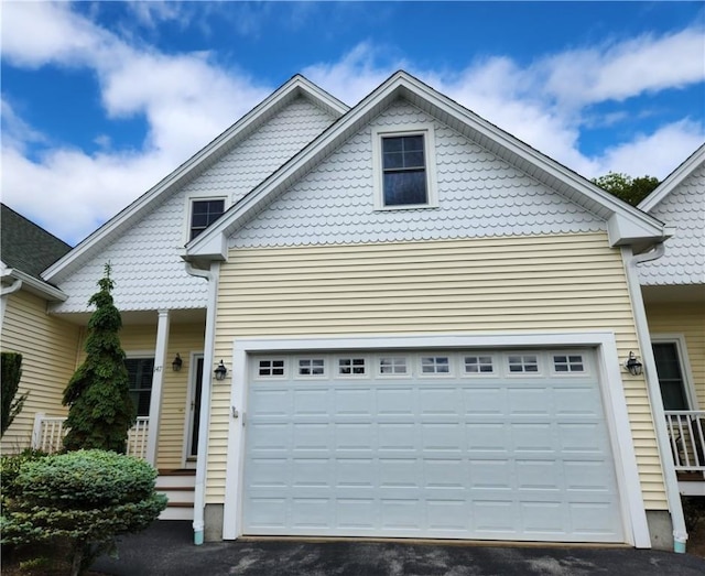 147 Southwinds Dr, South Kingstown, RI 02879 - view of front of house featuring asphalt driveway