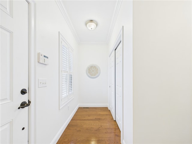 147 Southwinds Dr, South Kingstown, RI 02879 - hallway featuring crown molding, wood finished floors, and baseboards