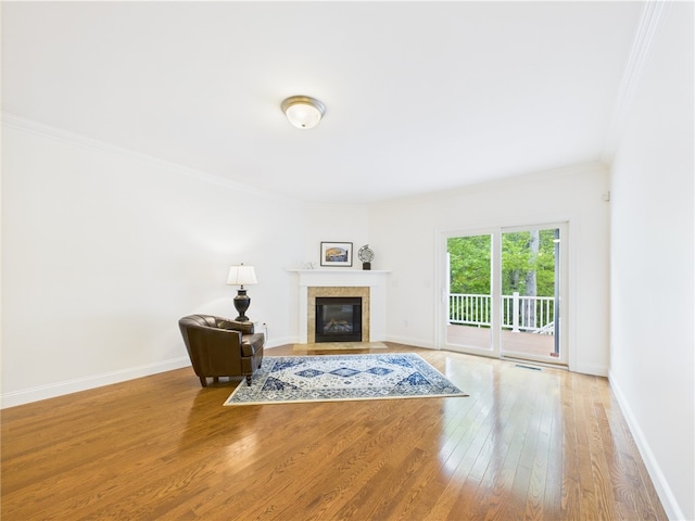 147 Southwinds Dr, South Kingstown, RI 02879 - living area featuring ornamental molding, a fireplace, wood finished floors, and baseboards