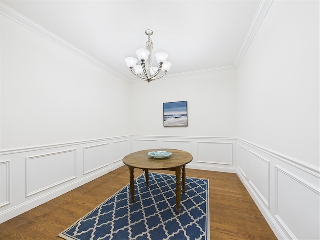 147 Southwinds Dr, South Kingstown, RI 02879 - sitting room with a chandelier, ornamental molding, a wainscoted wall, dark wood-style floors, and a decorative wall