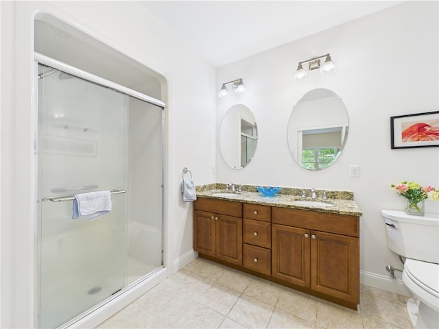 147 Southwinds Dr, South Kingstown, RI 02879 - bathroom featuring toilet, double vanity, baseboards, a shower stall, and tile patterned flooring