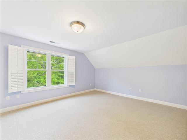 147 Southwinds Dr, South Kingstown, RI 02879 - bonus room featuring baseboards, light carpet, and lofted ceiling