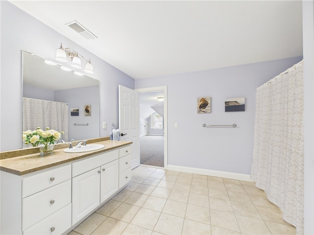 147 Southwinds Dr, South Kingstown, RI 02879 - full bath with vanity, tile patterned floors, and baseboards