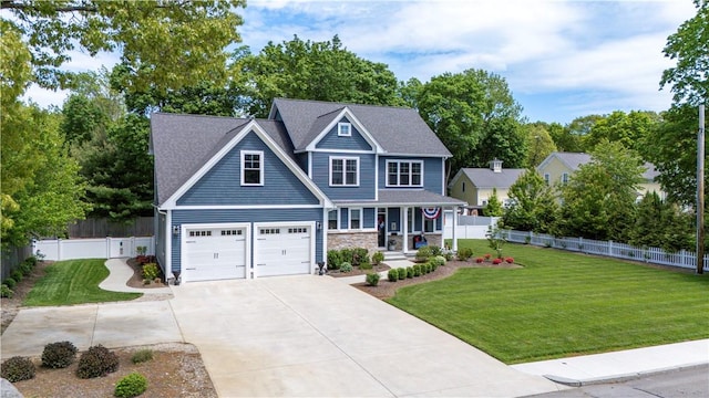 360 Pleasant St, East Providence, RI 02916 - craftsman-style home with covered porch, driveway, a garage, stone siding, and view of scattered trees