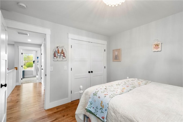 360 Pleasant St, East Providence, RI 02916 - bedroom featuring light wood-type flooring, a closet, and baseboards