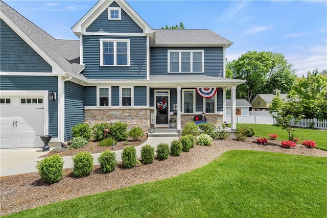 360 Pleasant St, East Providence, RI 02916 - craftsman inspired home with a porch, a garage, roof with shingles, concrete driveway, and stone siding