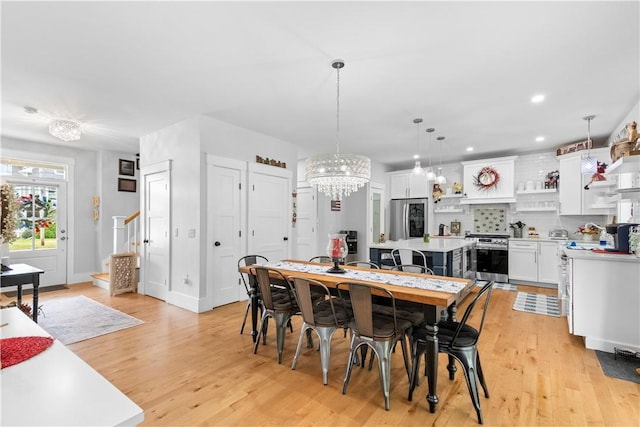 360 Pleasant St, East Providence, RI 02916 - dining room with light wood finished floors, a chandelier, and recessed lighting