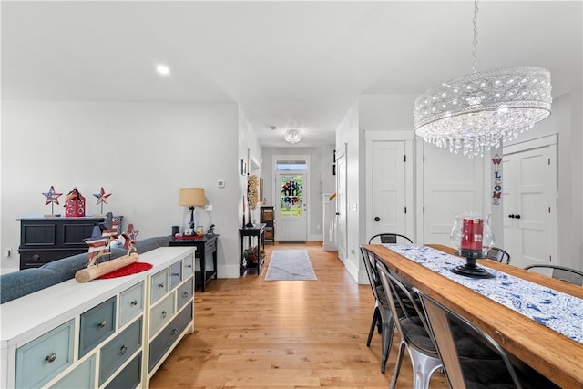 360 Pleasant St, East Providence, RI 02916 - dining room featuring light wood-style floors, a chandelier, and baseboards