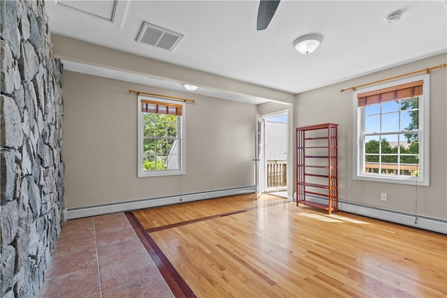 30 First School St, Bristol, RI 02809 - empty room featuring a baseboard radiator, a smoke detector, and wood finished floors