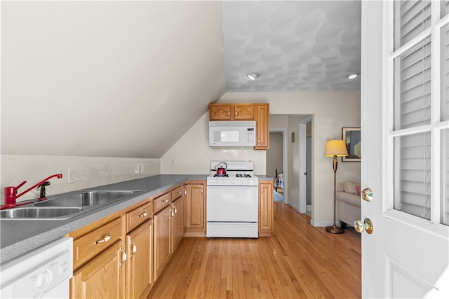 30 First School St, Bristol, RI 02809 - kitchen with white appliances, a sink, light wood-style floors, tasteful backsplash, and vaulted ceiling
