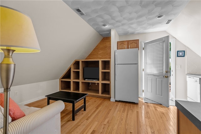 30 First School St, Bristol, RI 02809 - sitting room featuring vaulted ceiling, light wood finished floors, and baseboards