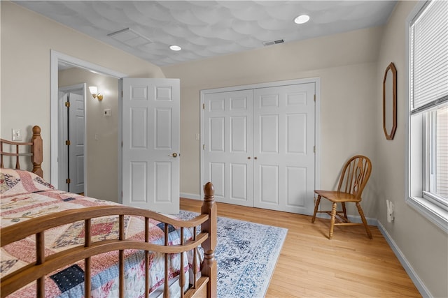 30 First School St, Bristol, RI 02809 - bedroom featuring light wood-style flooring, baseboards, and a closet