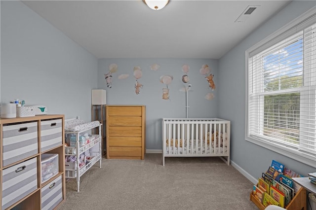 4 Overlook Cir, Coventry, RI 02816 - carpeted bedroom with multiple windows, a nursery area, and baseboards
