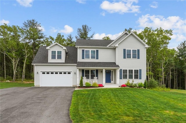 4 Overlook Cir, Coventry, RI 02816 - traditional-style house with covered porch, driveway, a garage, and a front yard