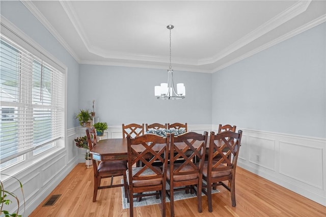 4 Overlook Cir, Coventry, RI 02816 - dining room with light wood finished floors, a chandelier, wainscoting, crown molding, and a tray ceiling