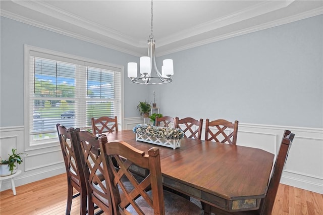 4 Overlook Cir, Coventry, RI 02816 - dining area featuring a chandelier, light wood finished floors, crown molding, wainscoting, and a decorative wall