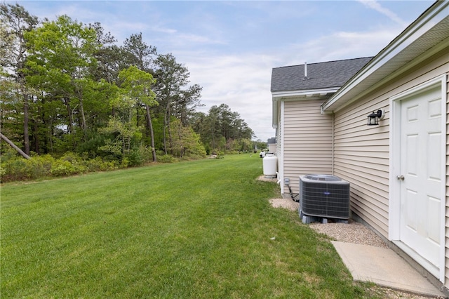 109 Chickadee Ln Unit A24, South Kingstown, RI 02879 - view of green lawn with central AC
