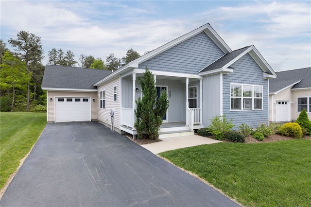 109 Chickadee Ln Unit A24, South Kingstown, RI 02879 - single story home featuring a garage, covered porch, asphalt driveway, and a front lawn