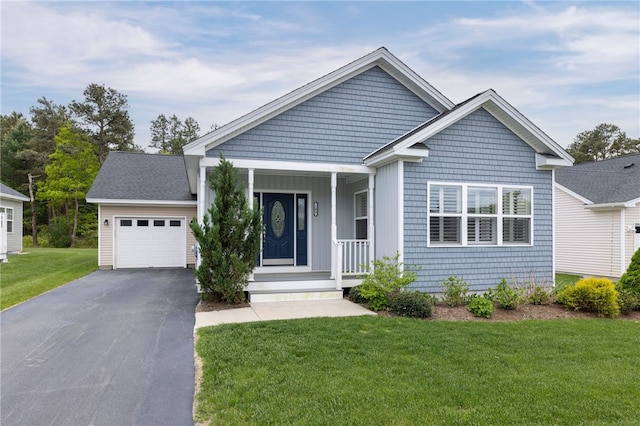 109 Chickadee Ln Unit A24, South Kingstown, RI 02879 - view of front of house with a garage, a front lawn, asphalt driveway, and a porch