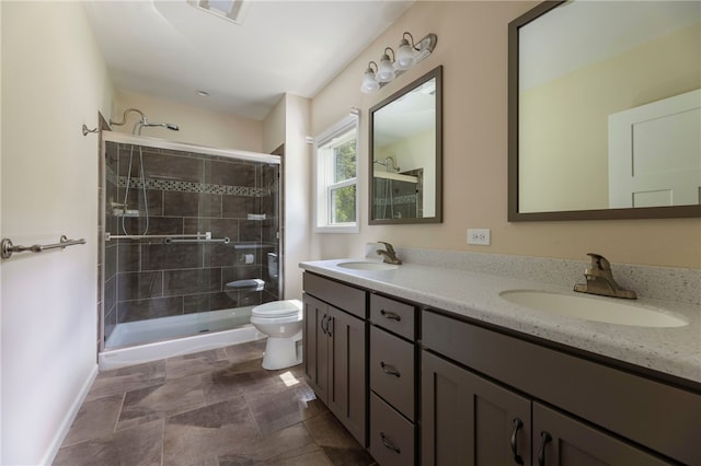 109 Chickadee Ln Unit A24, South Kingstown, RI 02879 - bathroom with double vanity, toilet, a shower stall, and baseboards