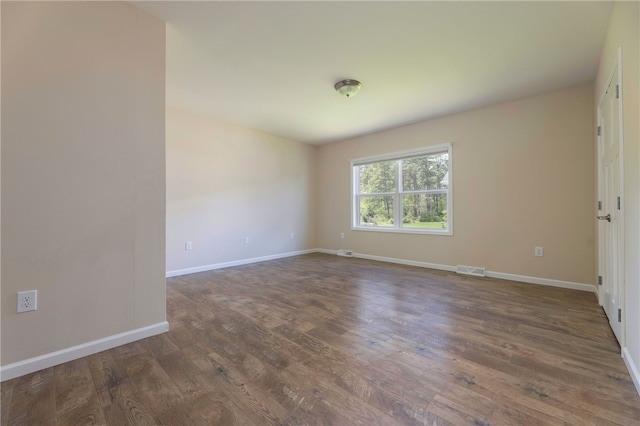 109 Chickadee Ln Unit A24, South Kingstown, RI 02879 - spare room with dark wood-style flooring and baseboards