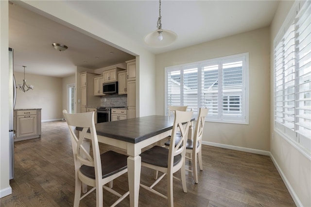 109 Chickadee Ln Unit A24, South Kingstown, RI 02879 - dining space featuring wood finished floors, baseboards, and a chandelier