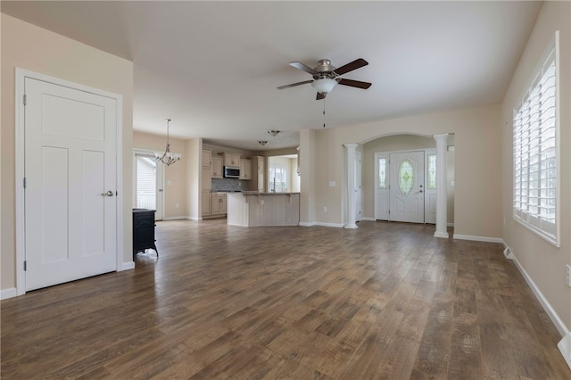 109 Chickadee Ln Unit A24, South Kingstown, RI 02879 - unfurnished living room with ornate columns, a ceiling fan, baseboards, dark wood-style floors, and healthy amount of natural light