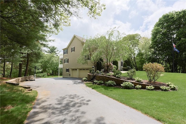 51 Reservoir Rd, Cumberland, RI 02864 - view of front of property with an attached garage, driveway, and a front lawn