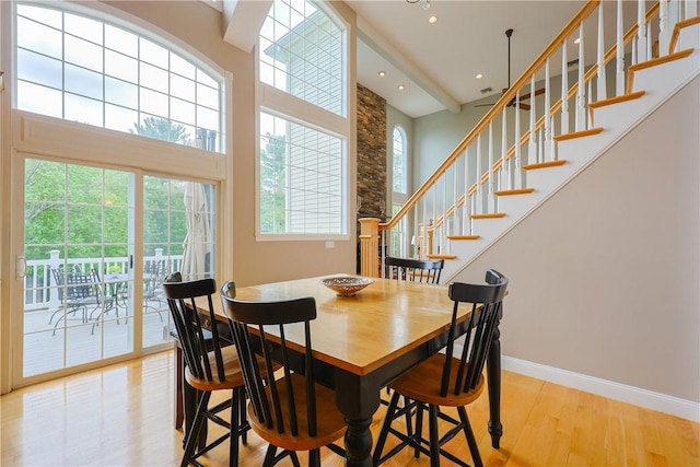 51 Reservoir Rd, Cumberland, RI 02864 - dining room featuring wood finished floors, a high ceiling, stairs, baseboards, and recessed lighting