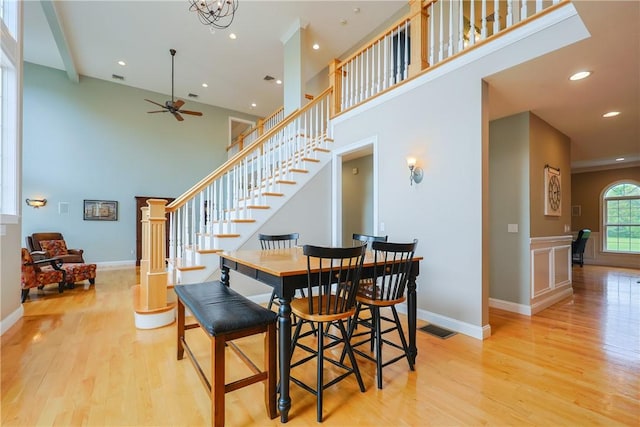 51 Reservoir Rd, Cumberland, RI 02864 - dining area featuring light wood finished floors, a ceiling fan, stairway, a high ceiling, and recessed lighting