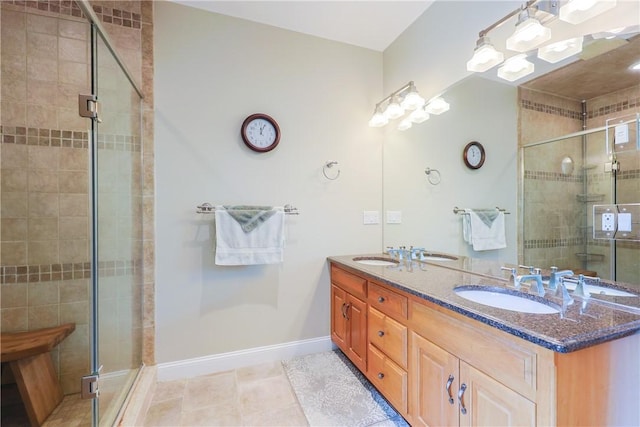 51 Reservoir Rd, Cumberland, RI 02864 - bathroom with double vanity, a shower stall, baseboards, and tile patterned floors