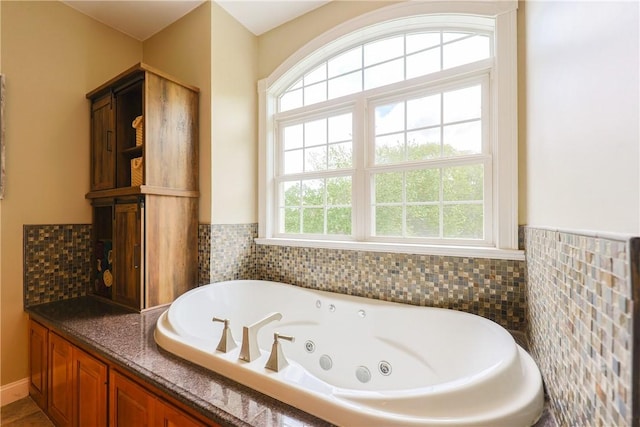 51 Reservoir Rd, Cumberland, RI 02864 - full bathroom with a whirlpool tub, wainscoting, and tile walls