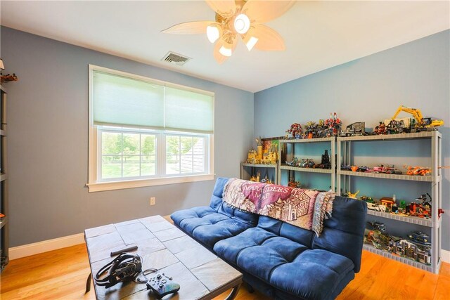 51 Reservoir Rd, Cumberland, RI 02864 - living room featuring a ceiling fan, wood finished floors, and baseboards