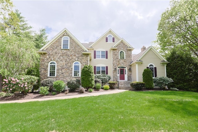 51 Reservoir Rd, Cumberland, RI 02864 - view of front facade with a front yard and stone siding