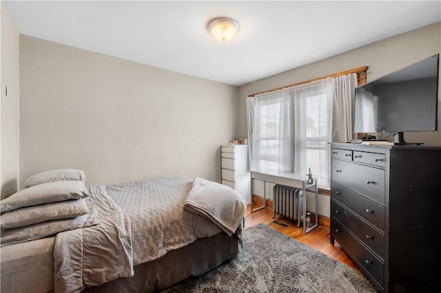 93 Pleasant St, Cranston, RI 02910 - bedroom featuring light wood-style floors and radiator heating unit
