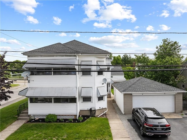 93 Pleasant St, Cranston, RI 02910 - view of front of home featuring a detached garage, roof with shingles, and a front yard